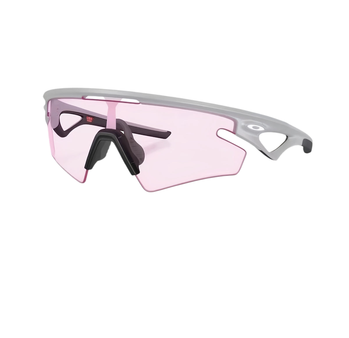 라이트 그레이 프레임과 연한 핑크 실드 렌즈의 Oakley Sphaera Strike 선글라스