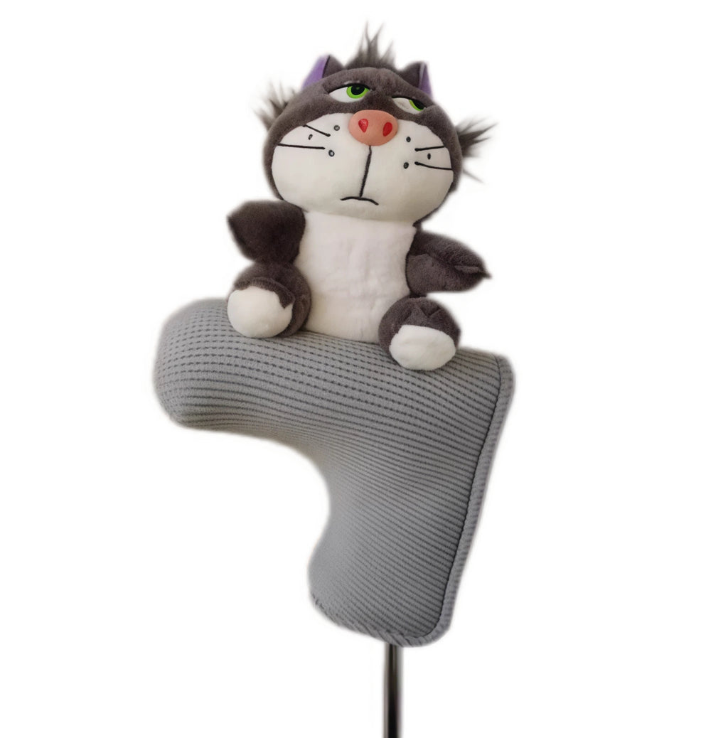 Grumpy grey and white plush cat golf headcover sitting atop a grey ribbed blade putter cover, green eyes and pink nose