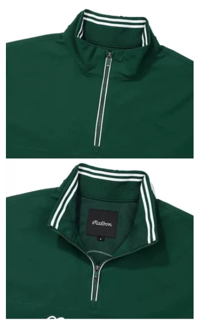 Malbon men half-zip stand collar golf polo sleeve and shoulder seam detail