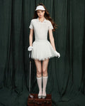 NowRose White golf polo and pleated skirt model front view
