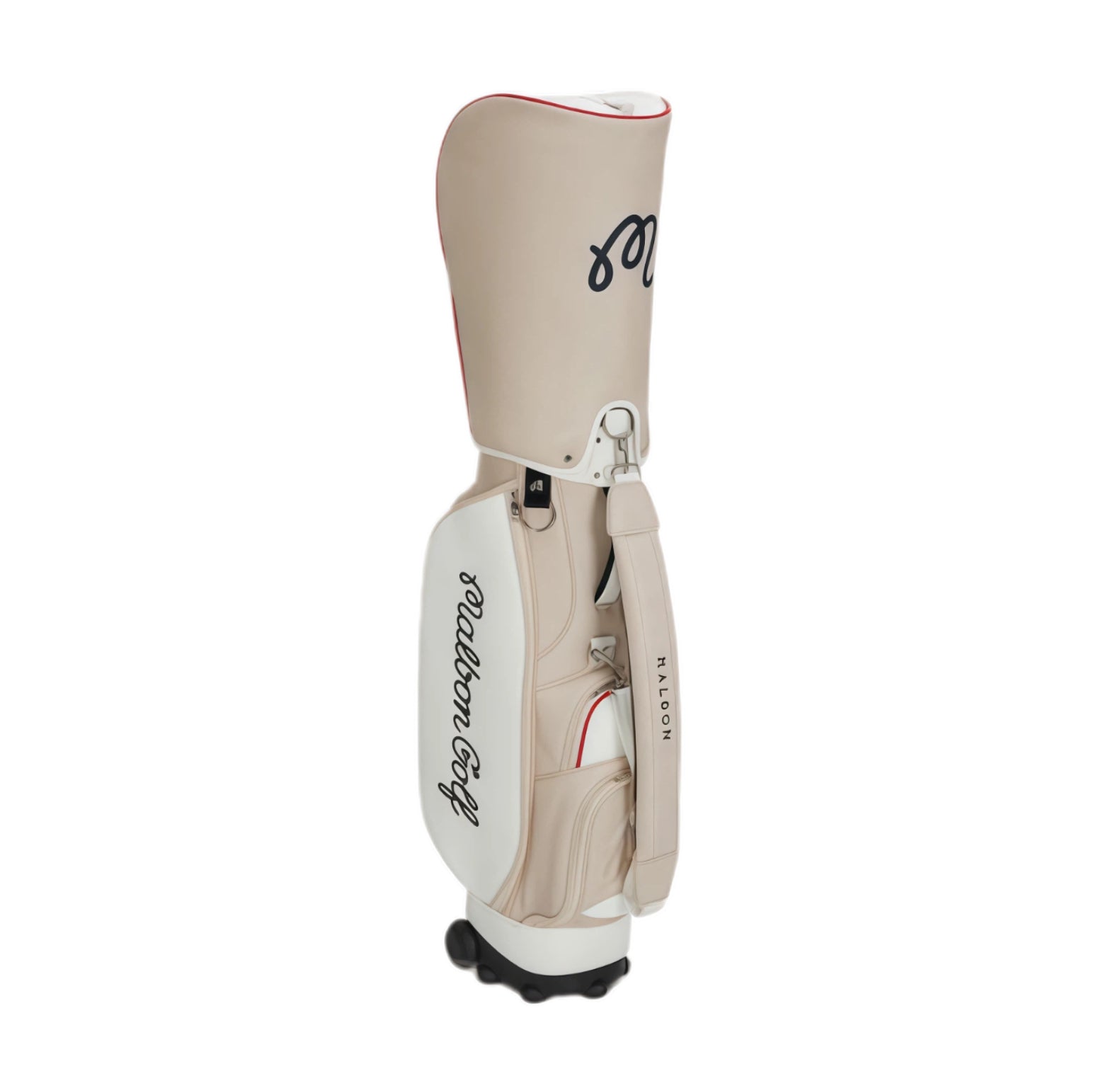 Rear view of beige Malbon Golf cart bag showcasing "Malbon Golf" script logo, padded shoulder strap, and Halon-branded handle. Designed for comfort and style during play.