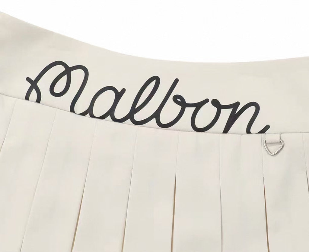 Malbon Women's Logo Pleated Golf Skort Beige pleated golf skort front view