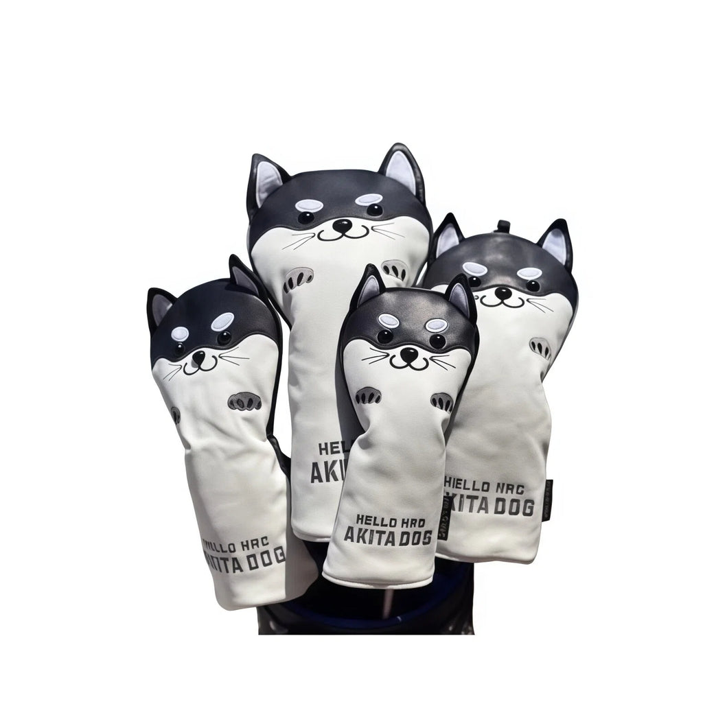 Close-up of a black Akita Inu golf headcover set mounted on a golf bag, highlighting the detailed dog face, soft fabric texture, and secure fit — ideal for protecting driver, fairway, and hybrid clubs in style.