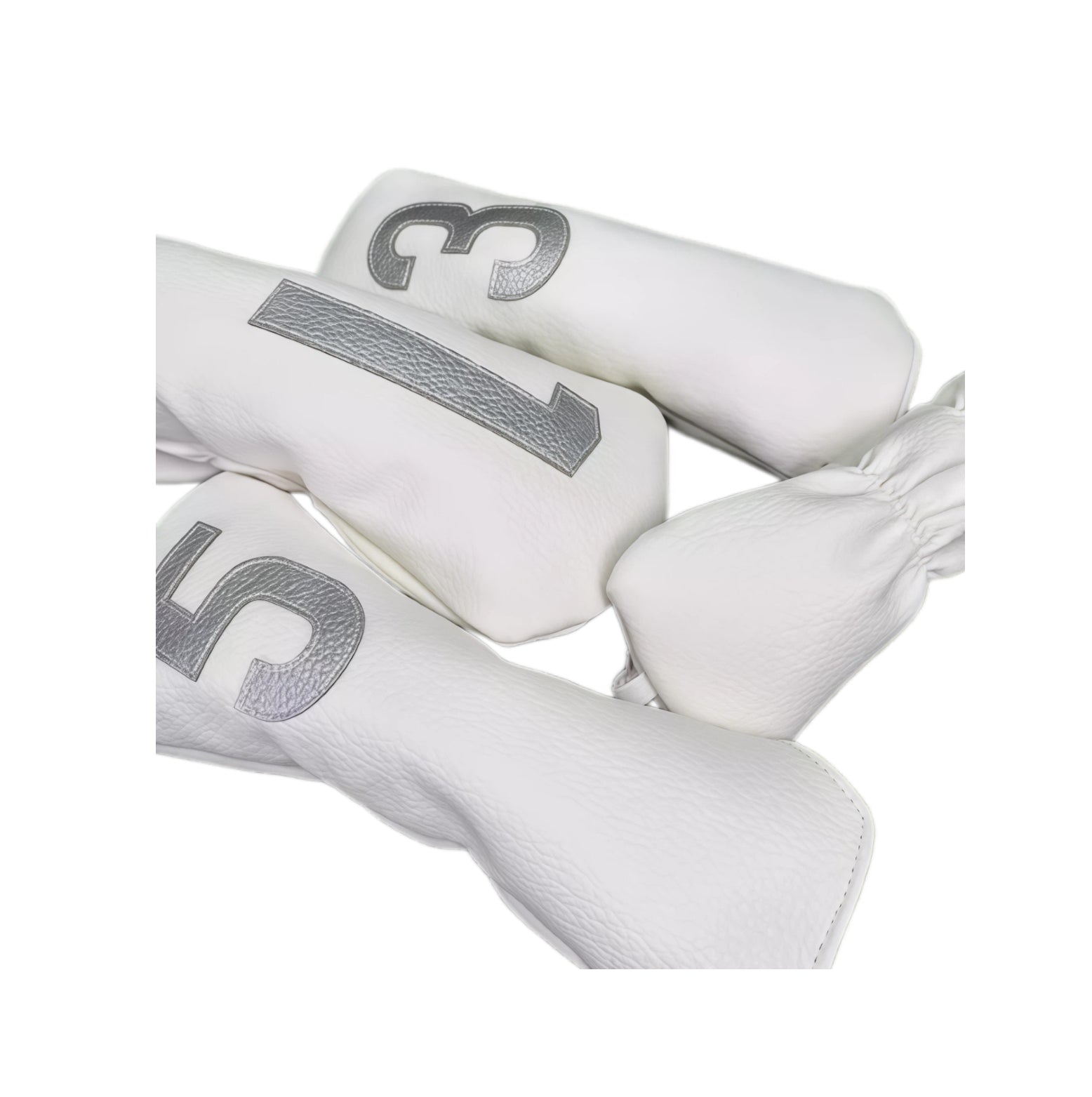 Close-up view of white Korean style PU golf headcovers showing silver embroidered numbers and textured PU leather surface, designed for driver, fairway and utility clubs.