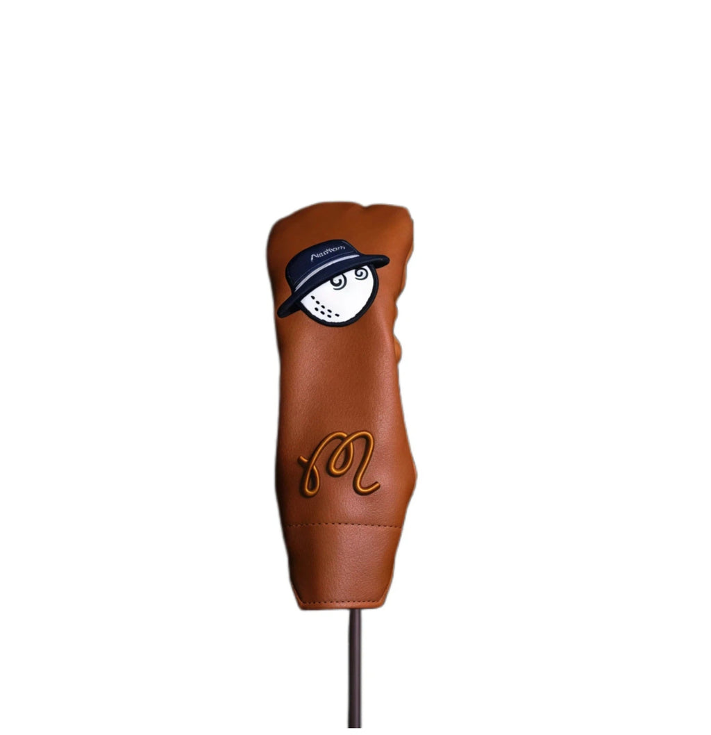 Malbon Bucket Hat Iron Headcover featuring a cartoon golf ball with a bucket hat and the "Malbon" "M" logo, made from durable brown PU leather with white trim for iron club protection.
