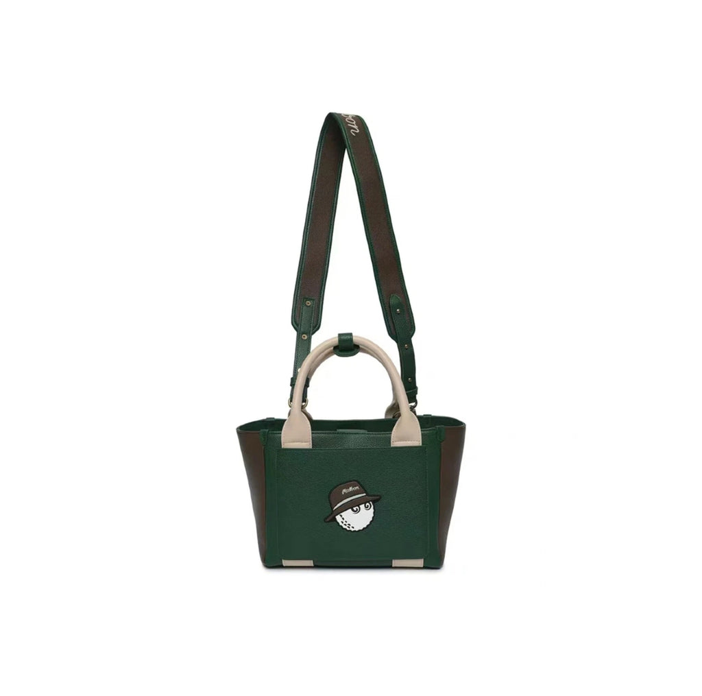 Front shot of the Malbon green and brown mini tote bag with a cute golf ball mascot wearing a hat. Premium texture, dual carrying options, and vintage golf aesthetic.