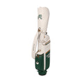 Front view of Malbon Golf "Amongst the Cypress" stand bag in cream and green colorway, featuring waterproof PU leather, adjustable shoulder strap, and cartoon golf ball patch logo.