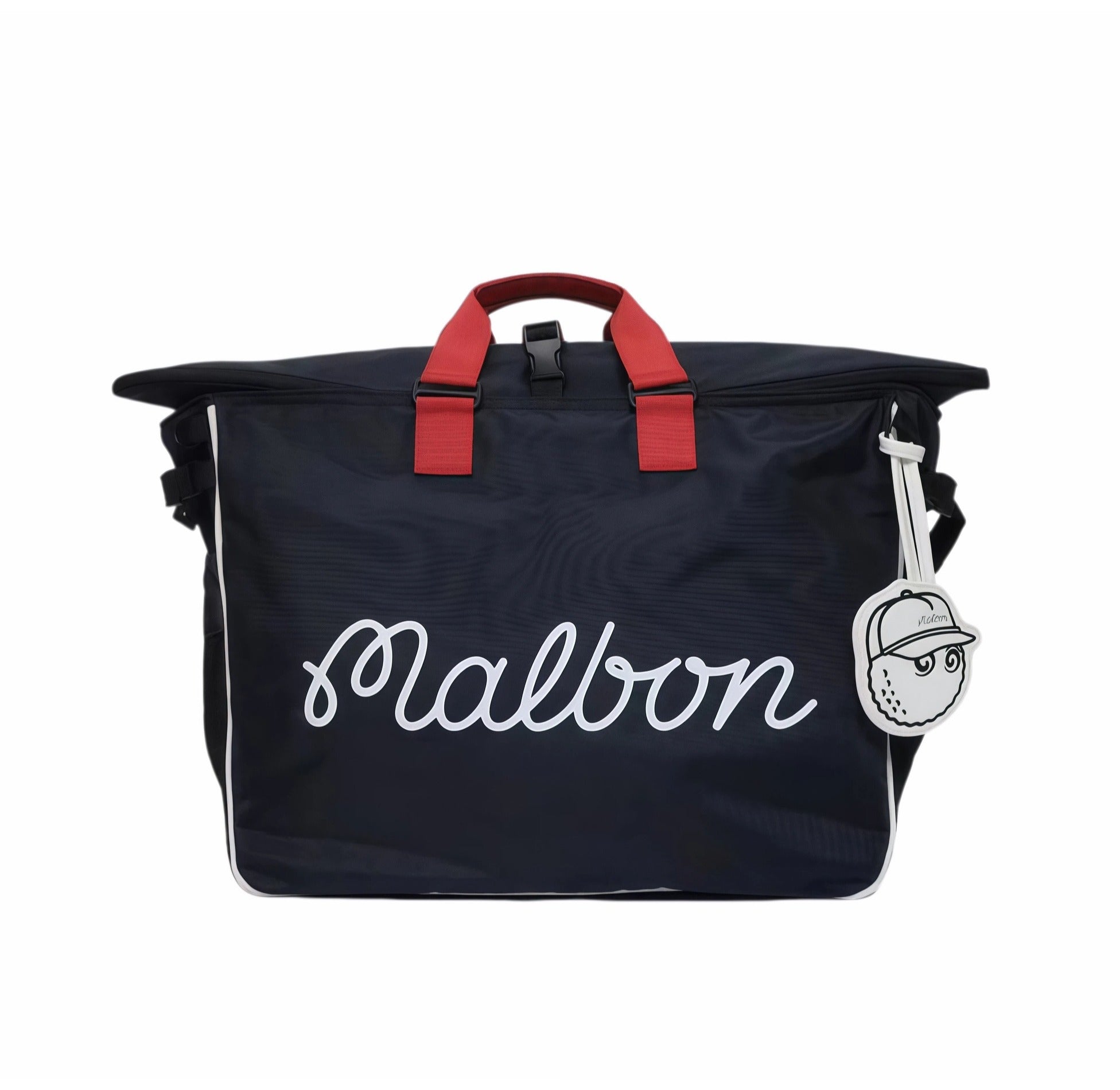 Front view of Malbon Golf Heritage duffel bag in navy blue with white cursive "Malbon" embroidery, red top handles, and a cartoon golf ball charm attached