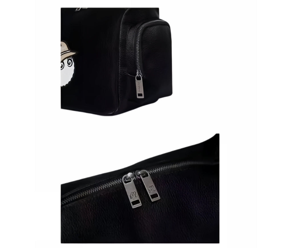  Close-up detail of Malbon Golf small shoulder bag showing textured black PU leather, side zip pocket with silver zipper, and dual metal zip pulls engraved with "M" logo