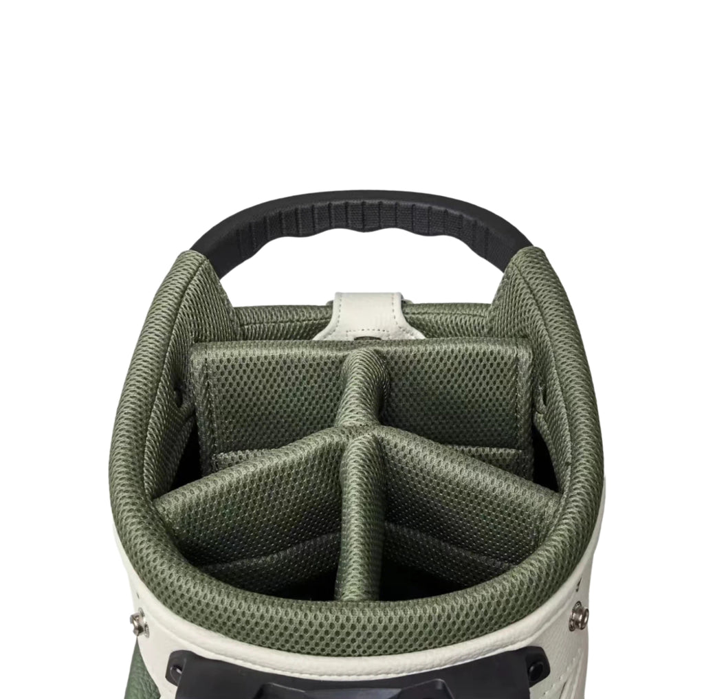 Top-down view of Malbon Golf Stand Bag interior showing green mesh dividers, padded club slots, and durable fabric lining. Designed for organized storage and protection of golf clubs.
