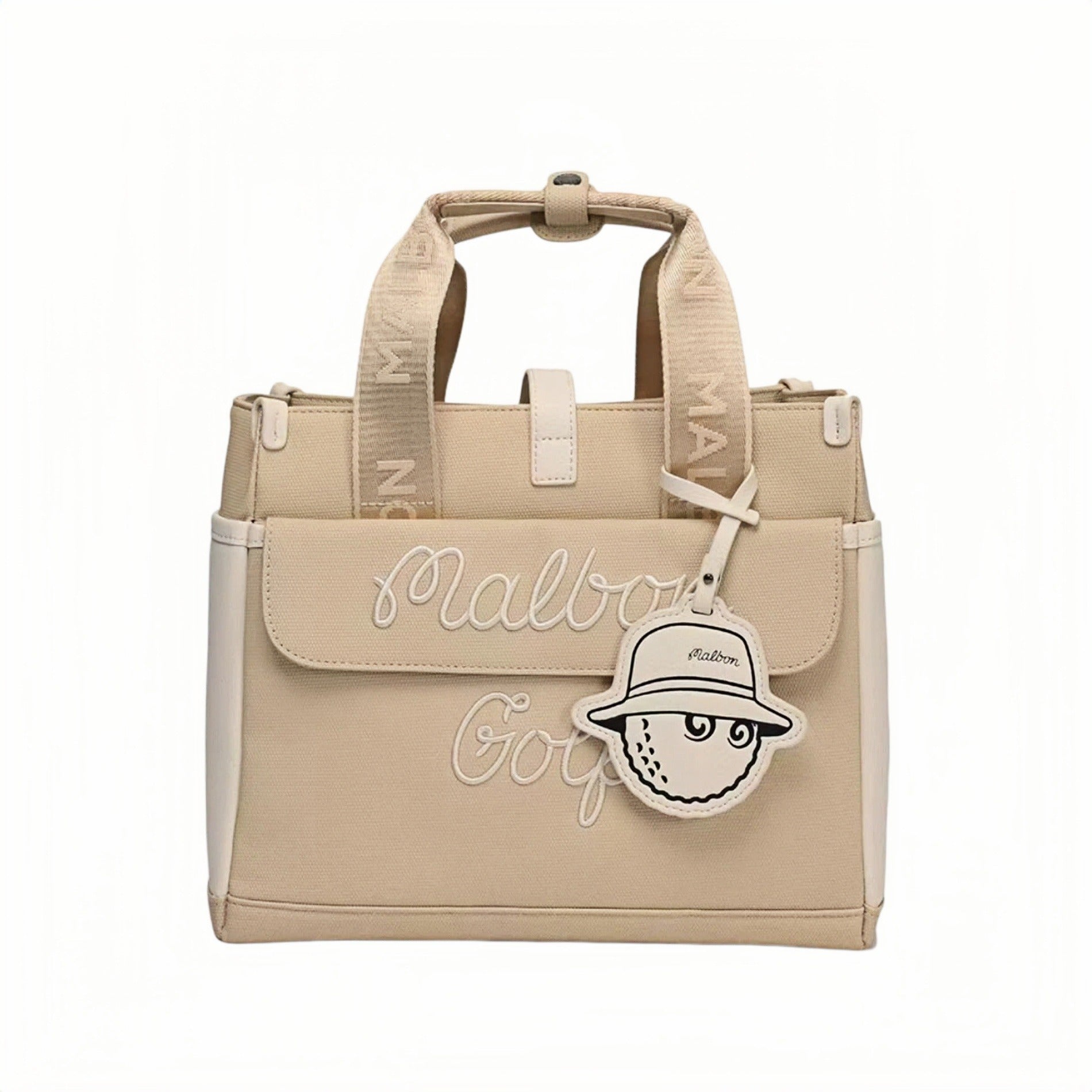 Beige Malbon golf tote bag featuring white embroidered "Malbon Golf" script, front flap design, and cute golf ball-shaped charm hanging from the handle