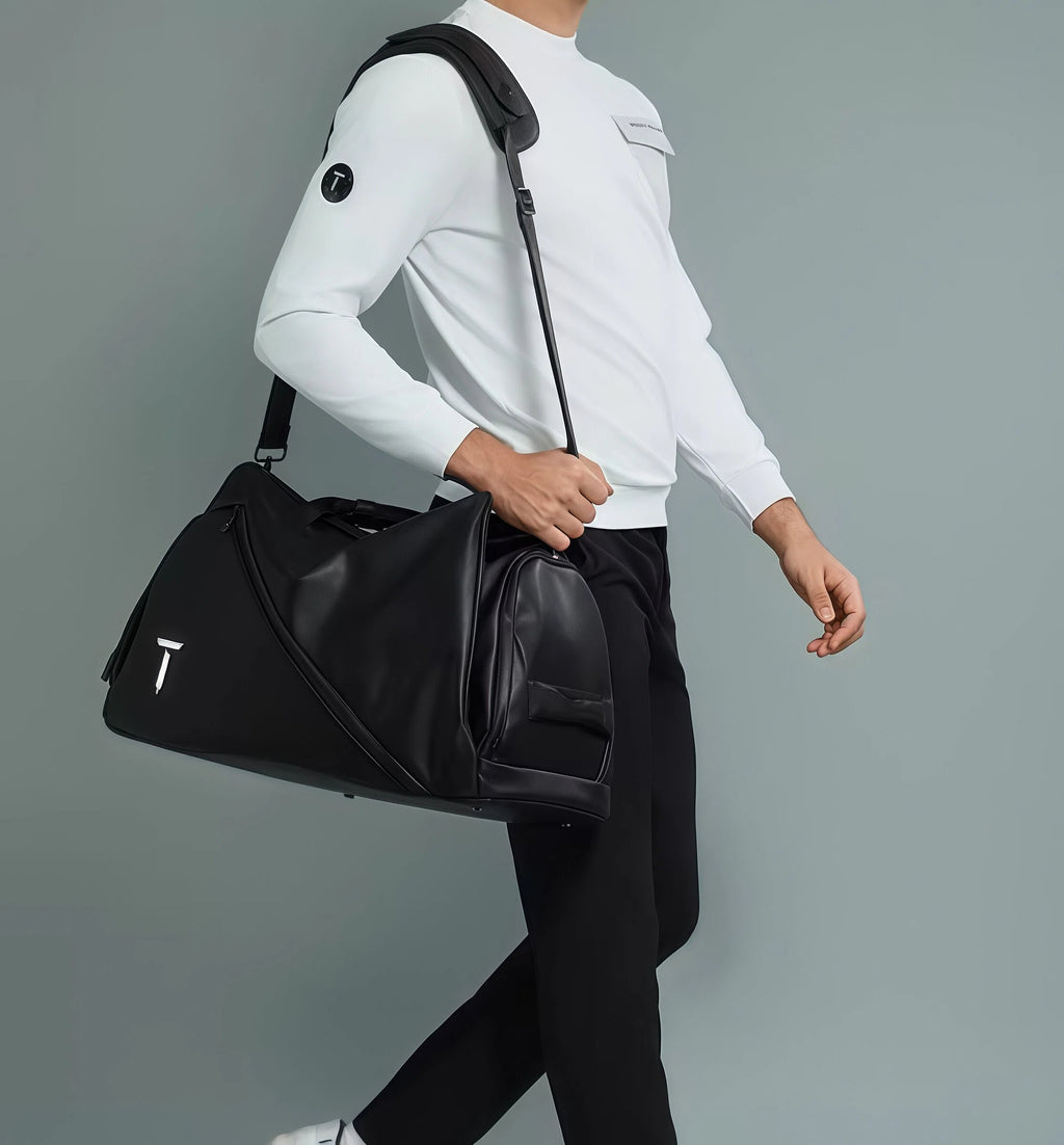 Man wearing the black European Tour duffel bag over his shoulder, showcasing its sleek design and practicality. Perfect for golf, gym, or daily use.