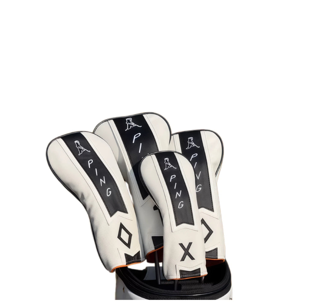 Side view of PING limited edition Masters Pin golf driver headcover, showcasing its sleek white and black design with orange trim, ensuring a secure fit on your driver club while adding a touch of exclusivity to your golf bag.