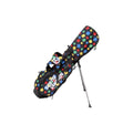 A side-angle view of the Scotty Cameron Pathfinder Agave Man stand bag. It features a black base with a vibrant, multi-colored agave plant pattern in red, blue, yellow, and green, with the "SCOTTY CAMERON" logo on the side pocket.