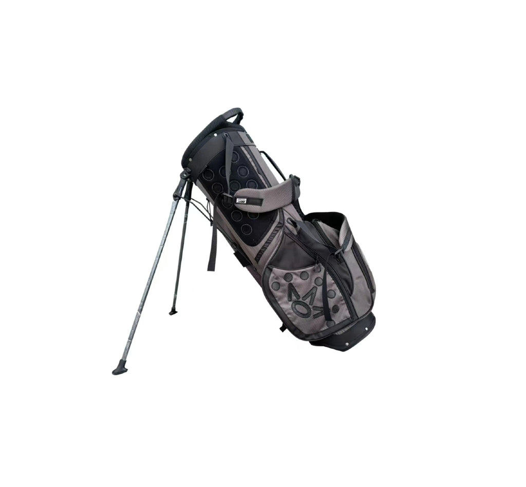 Angled view of the Scotty Cameron Pathfinder Mainstay Stand Bag in Charcoal. This lightweight golf bag features a sleek gray and black design with the iconic Circle T logo, "SCOTTY CAMERON MILLED PUTTERS" branding, and a durable dual-strap system.