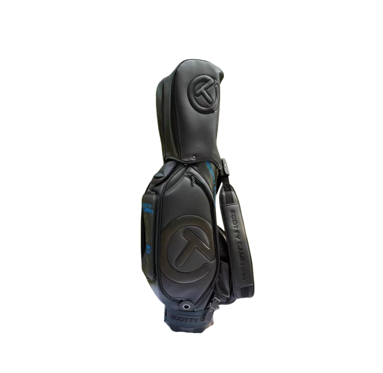 Side profile of the Scotty Cameron Backin Black Staff Bag featuring the embossed Circle T logo on the hood and "SCOTTY CAMERON" branding on the premium black leather strap.