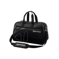 Front view of the TaylorMade Auth-Tech Boston bag in black featuring dual top handles, adjustable shoulder strap, and subtle embossed logo design. Made from durable water-resistant fabric with zippered compartments for organized storage of golf gear, apparel, and accessories.