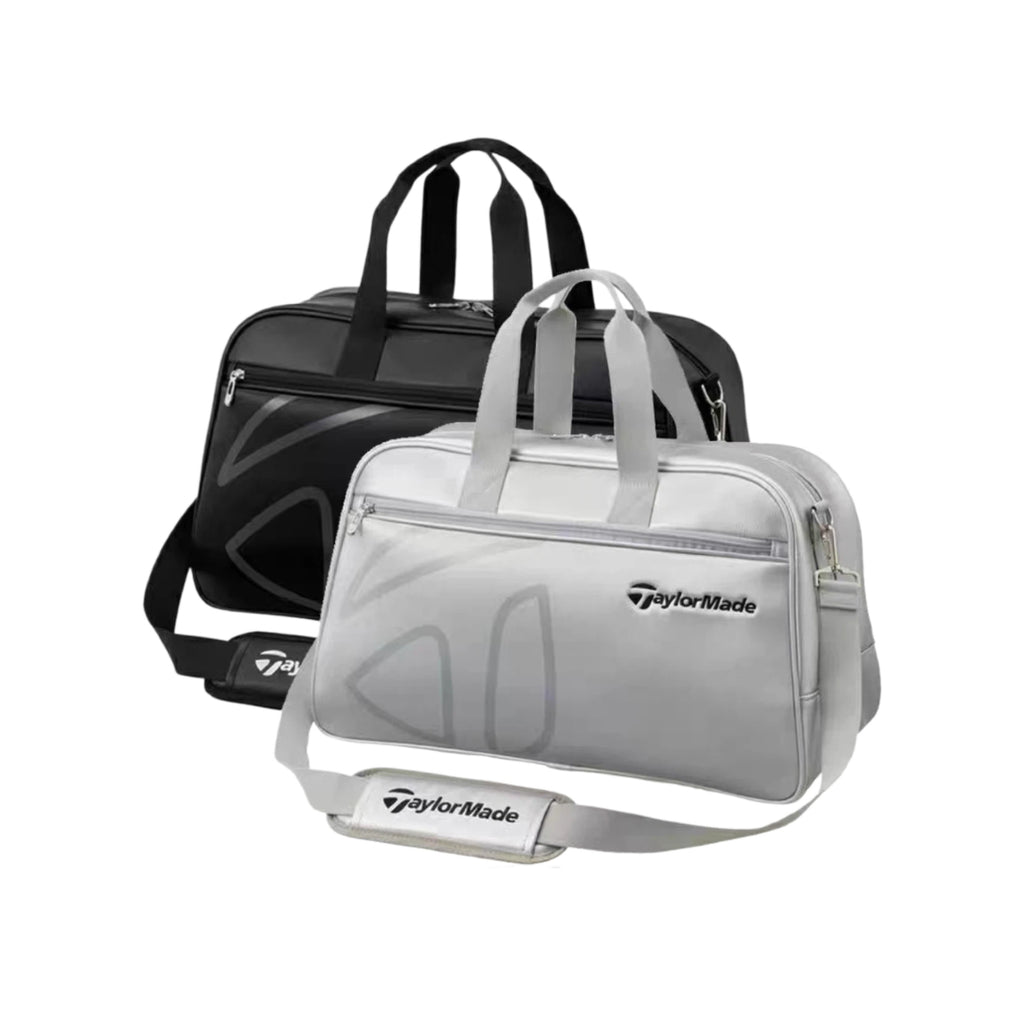 Side-by-side display of the TaylorMade Auth-Tech Boston bag in black and silver colorways. Both feature sleek designs, dual carry handles, padded shoulder straps, and premium branding. Ideal for golfers seeking stylish, functional duffel bags for travel or daily use.