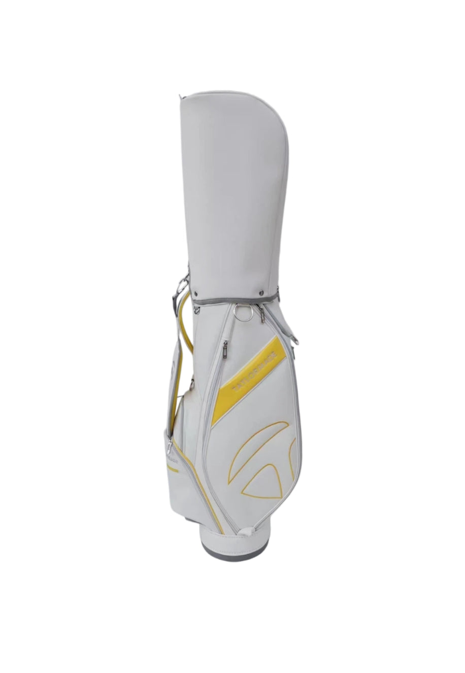 Side view of the TaylorMade Concept One golf cart bag in white with vibrant yellow trim and embossed logo. Features a durable synthetic exterior, dual carry handles, and a comfortable shoulder strap for easy transport during rounds or travel.