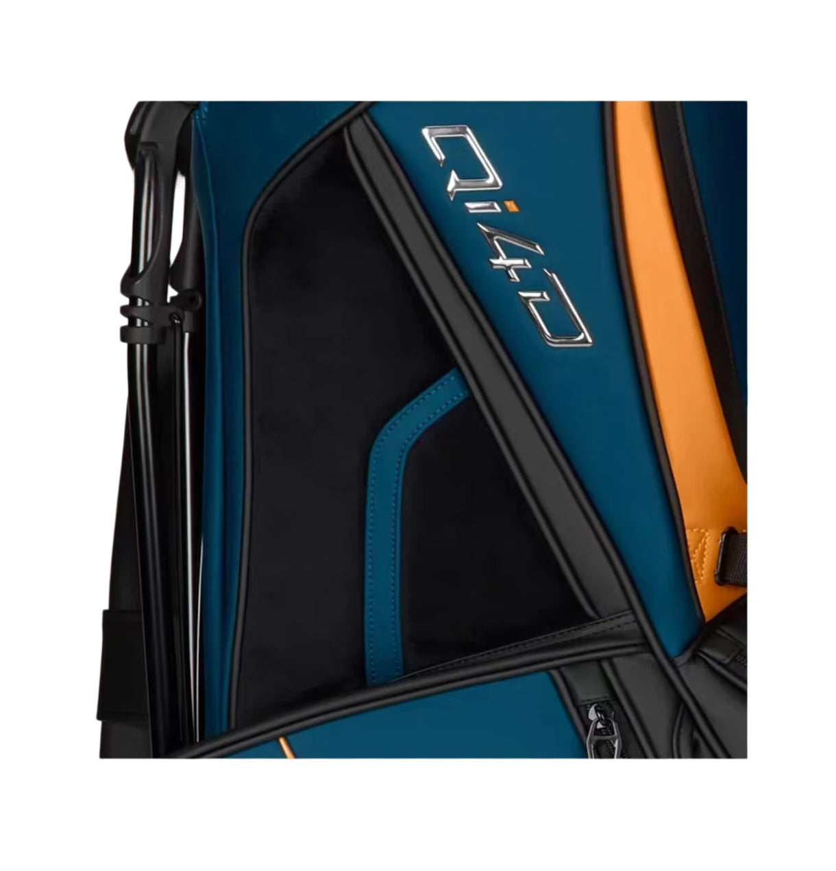 Detailed close-up of the TaylorMade Qi4D staff bag highlighting the silver "Qi4D" logo, orange accent stripe, and zippered accessory pocket. Crafted with high-quality synthetic fabric for durability and style on the golf course.
