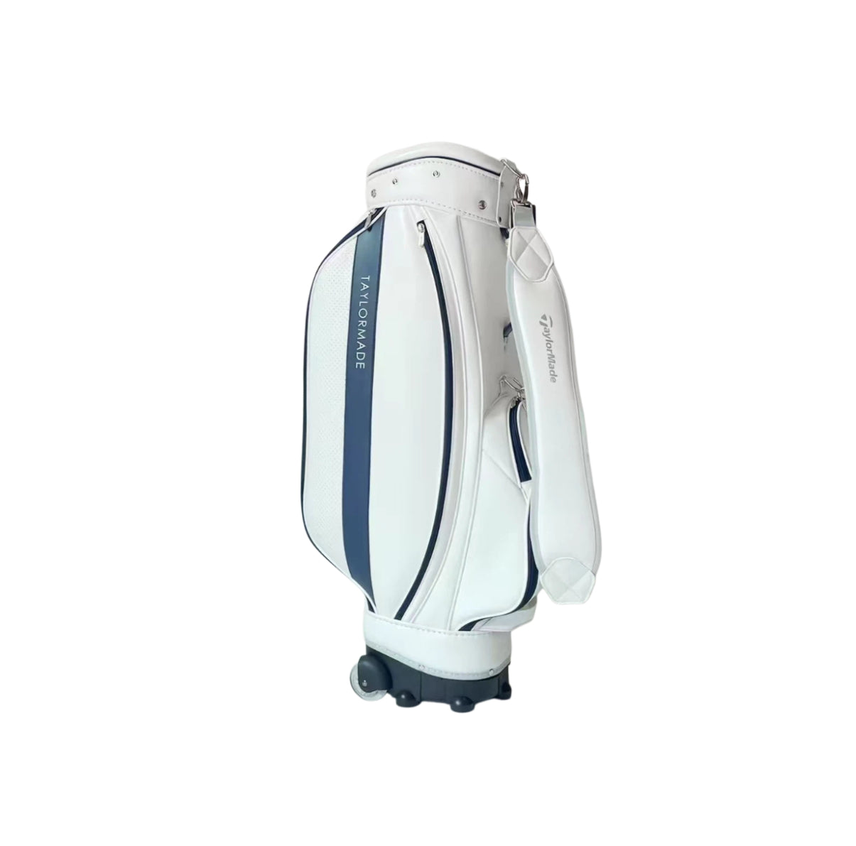 Side profile of the TaylorMade wheeled golf caddy bag in white and navy blue showcasing its ergonomic shoulder strap, dual-wheel base, and zippered pockets. Built for comfort and durability during long rounds or travel.