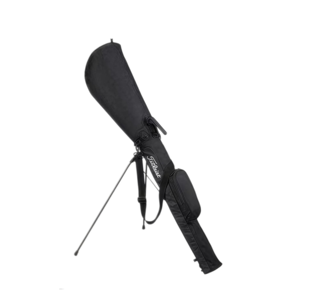 Angled view of the black Titleist lightweight stand golf bag with fully deployed dual stand legs. Features a padded top handle, durable fabric, and ergonomic design ideal for beginners and casual golfers.