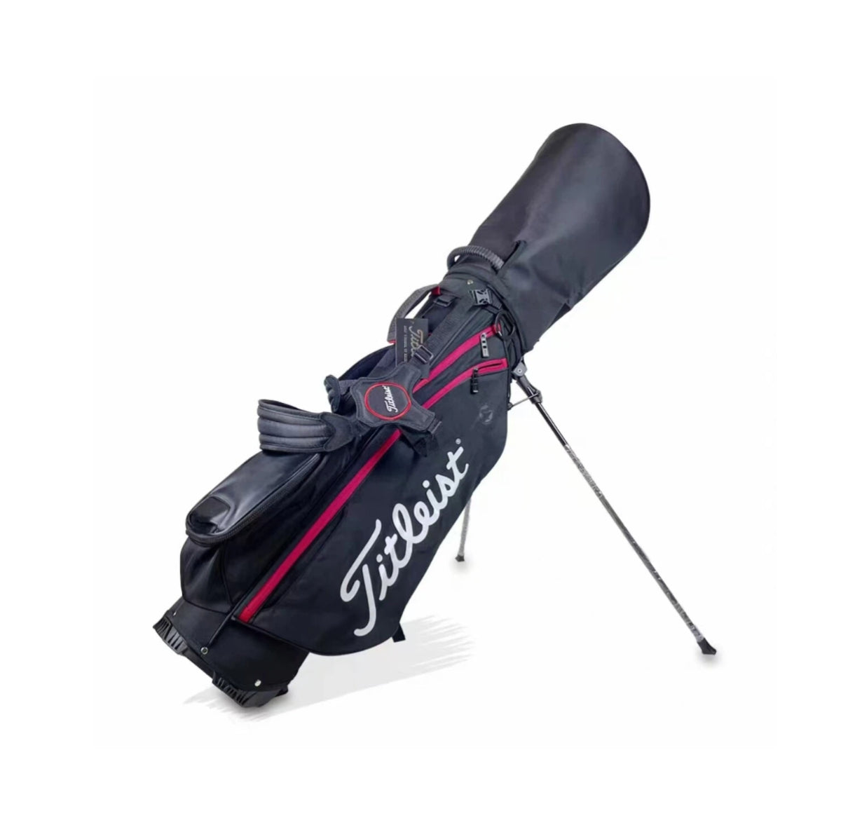 Side-angle view of the black Titleist carry golf bag with deployed stand legs, showcasing its lightweight frame, padded shoulder strap, and ergonomic design for comfortable carrying.