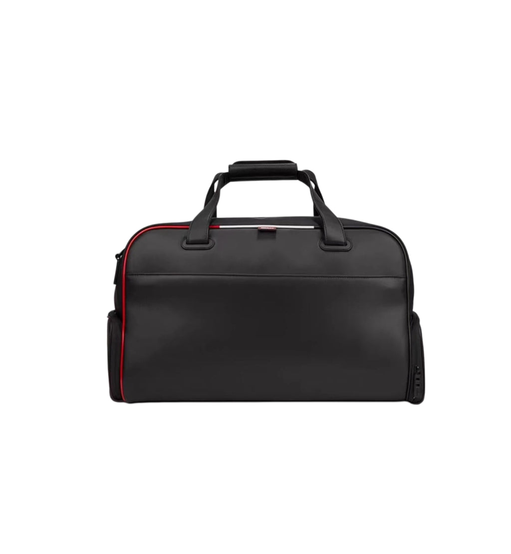 Front view of the black Titleist Premium Golf Duffel showcasing its smooth surface, red piping trim, and top carry handles. Ideal for stylish travel and golf gear storage.