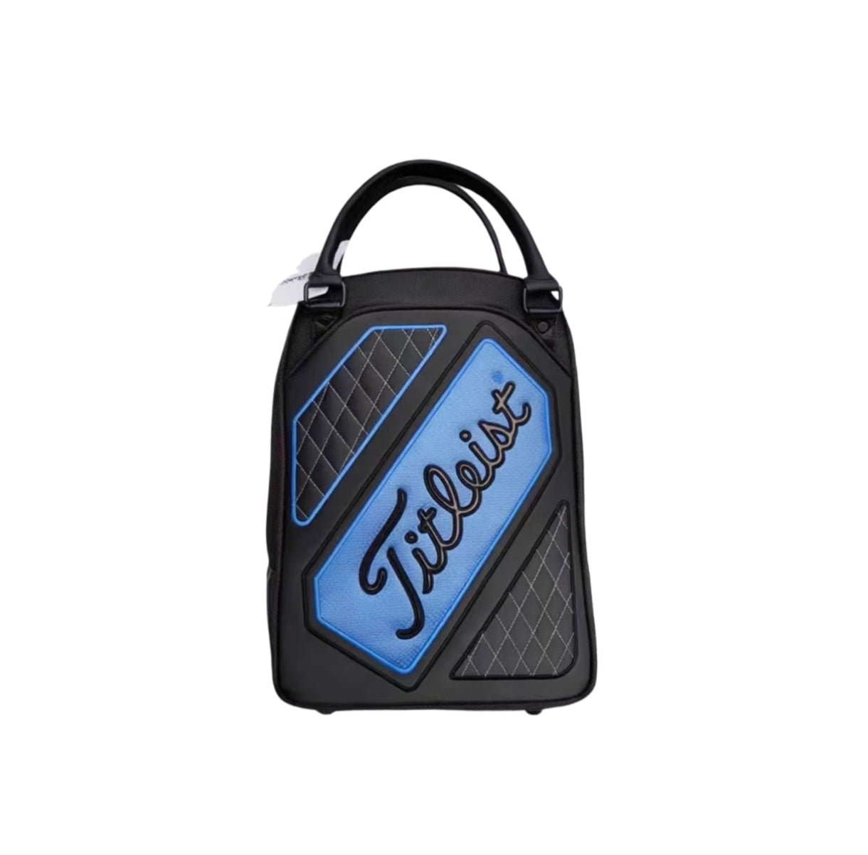 Front view of the Titleist Quilted Golf Tote Bag featuring a blue logo panel with black "Titleist" script, quilted diamond-patterned sides, dual top handles, and durable synthetic material. Ideal for carrying golf balls, tees, and accessories.