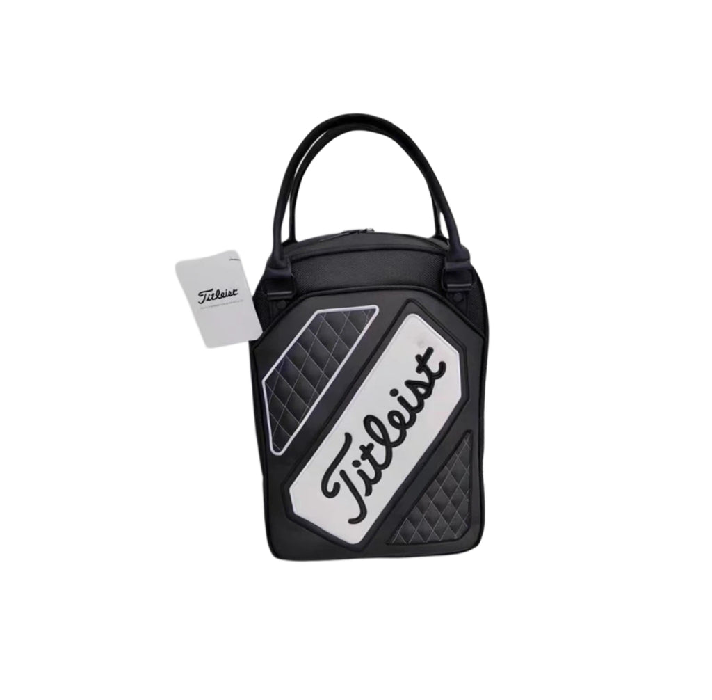 White version of the Titleist Quilted Golf Tote Bag showcasing a clean white logo panel with black "Titleist" script, quilted side panels, dual handles, and attached brand tag. Perfect for golfers seeking elegance and function.
